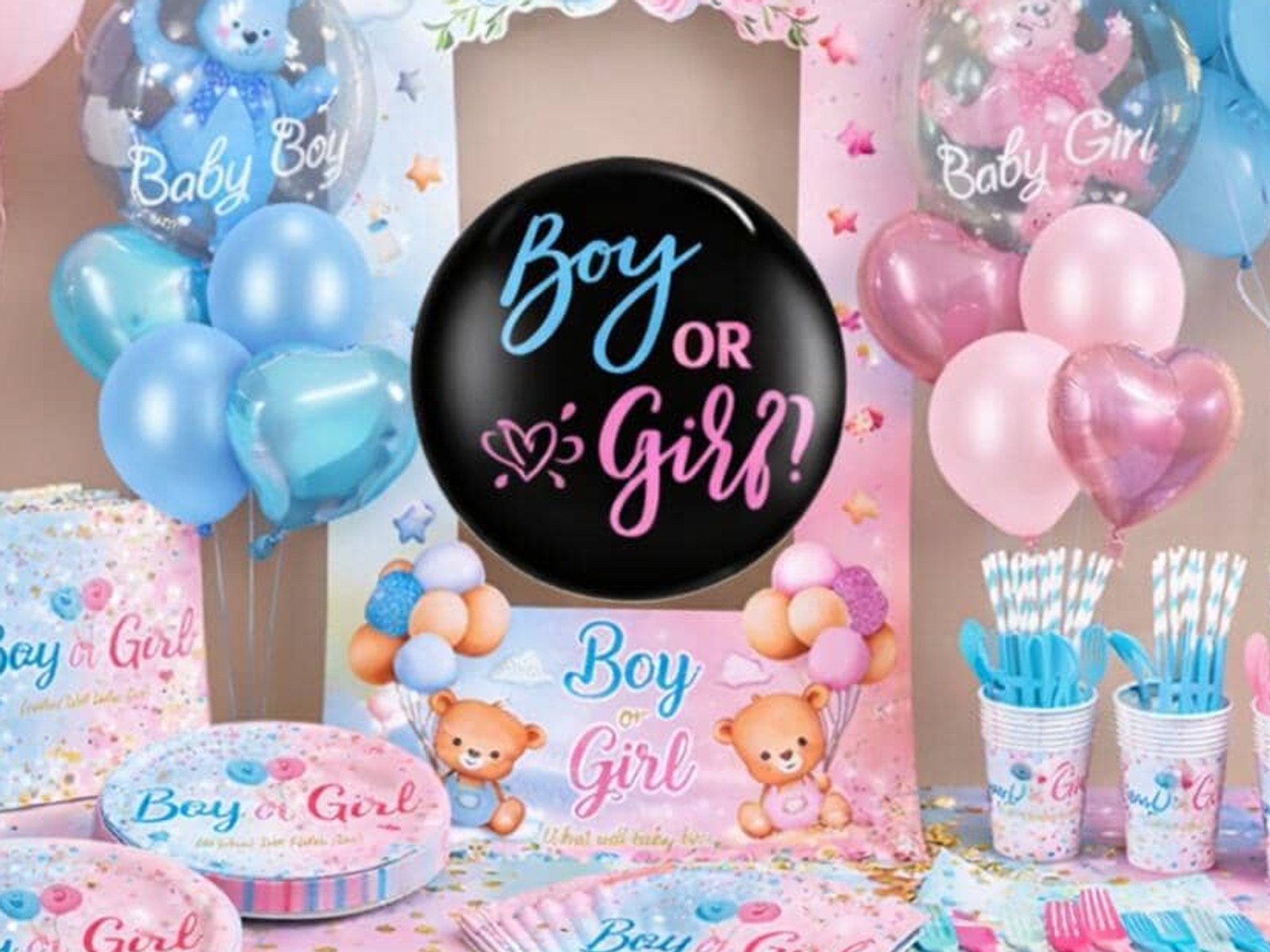 Teddy bear balloons, a black Boy or Girl balloon and a pink and blue gender reveal table with matching plates